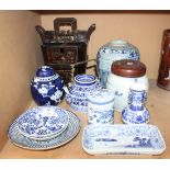 A pair of Japanese Arita blue and white porcelain saucer dishes, 19th Century, each painted with