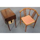 An early Victorian mahogany drop-flap work table fitted with two drawers, on turned legs and