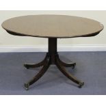 A 19th Century and later mahogany circular tip-top dining table, raised on a turned column and sabre