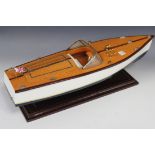 A 20th Century wooden model of a motor boat, length approx 50cm.