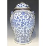 A Chinese blue and white baluster jar and domed cover, 19th Century, painted with an all-over design