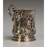 An early Victorian silver christening mug of gently tapering form with scroll handle, the body