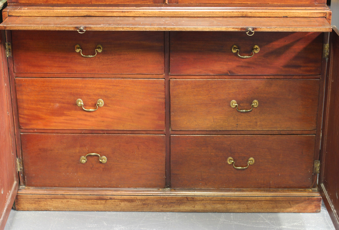 A late George III mahogany bookcase cabinet, the moulded pediment above a pair of astragal glazed - Image 2 of 2