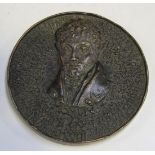 A mid-20th Century cast bronze medallion, one side with a portrait surrounded by concentric