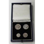 A George VI four-coin Maundy set 1952 with a blue case, detailed 'Maundy Money'.