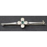 A diamond and emerald set five stone set cluster bar brooch, mounted with a rectangular cut