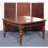 A mid-Victorian mahogany extending dining table, the top with a moulded edge and three extra leaves,