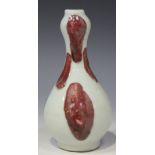 A Chinese porcelain bottle vase, of ovoid form with onion neck, probably modern, decorated with
