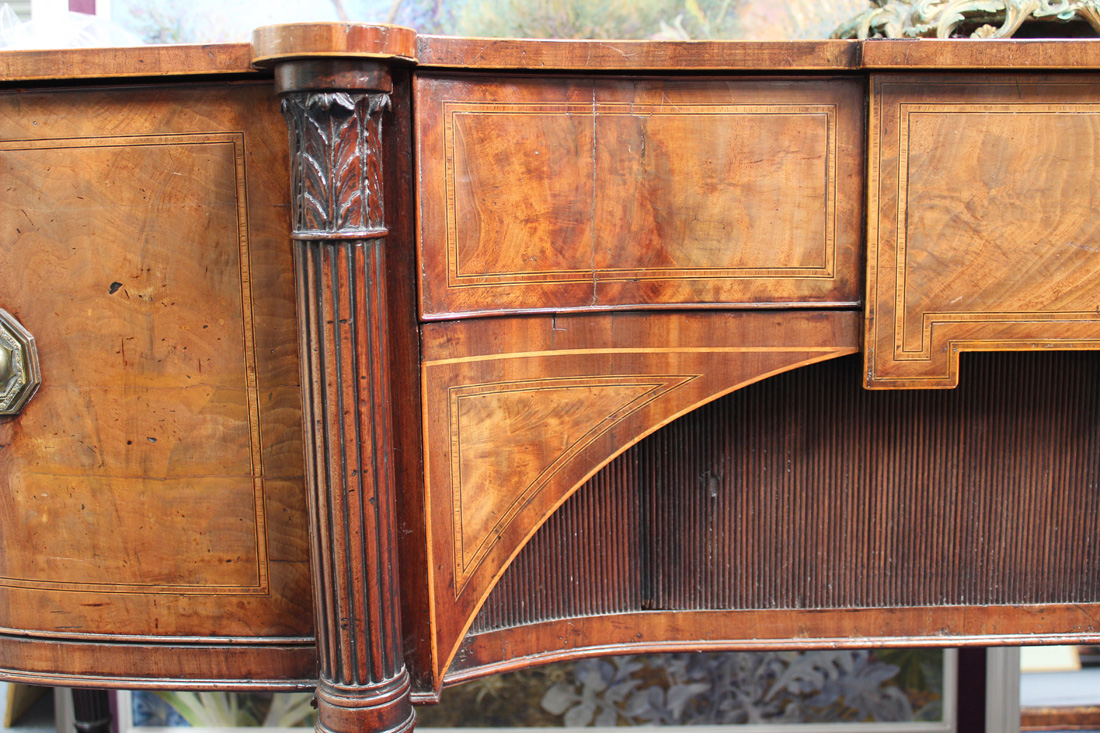 A George III figured mahogany and rosewood crossbanded sideboard, the shaped top with four - Image 3 of 4
