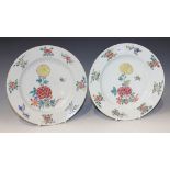 A pair of Chinese famille rose porcelain plates, Yongzheng period, each enamelled with central peony