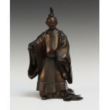 A Japanese bronze okimono figure of a shogun, Meiji/Taisho period, standing in full ceremonial