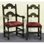 A set of six mid-20th Century Carolean Revival oak dining chairs, comprising two carvers and four