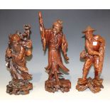 A Chinese carved hardwood figure of Shao Lao, mid-20th Century, modelled holding his peach and