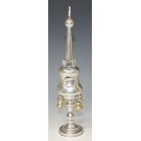 A George V silver Judaic spice tower, the spire with flag finial above baluster body with hinged
