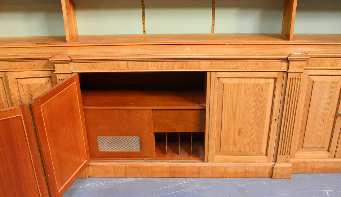 A 20th Century reproduction pine breakfront bookcase, fitted with open shelves above an - Image 2 of 2
