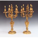 A pair of 19th Century French Louis XV style cast ormolu five light candelabra of overall foliate