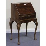 A 20th Century Queen Anne style walnut lady's writing bureau, the fall front above a single