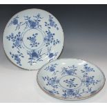 A pair of Chinese blue and white porcelain circular saucer dishes, Kangxi period, each painted