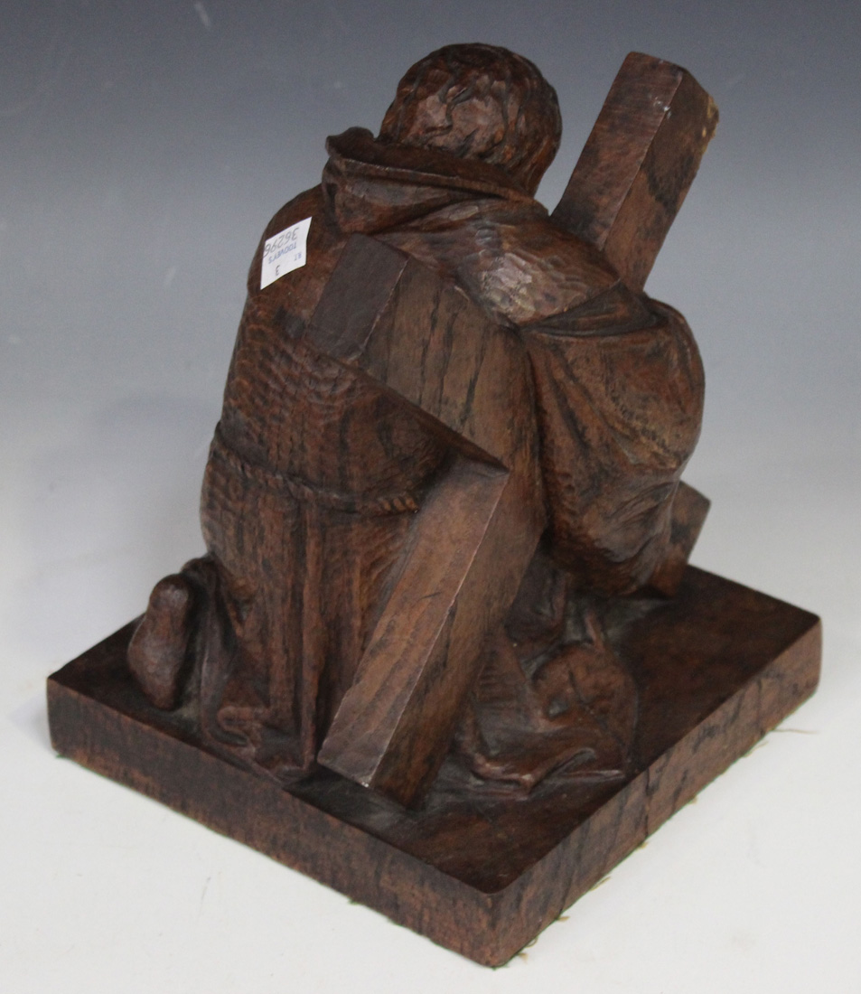 A 20th Century carved oak figure of St Andrew, praying on one knee and supporting an X-shaped cross, - Image 2 of 2