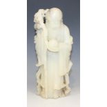 A Chinese soapstone carving of Shao Lao, early 20th Century, modelled standing wearing a long robe