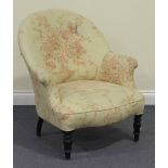 A late Victorian tub back armchair, raised on ebonized turned tapering legs, height approx 81cm,