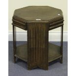 An Art Deco style oak octagonal occasional table, the frieze fitted with four pull-out slides