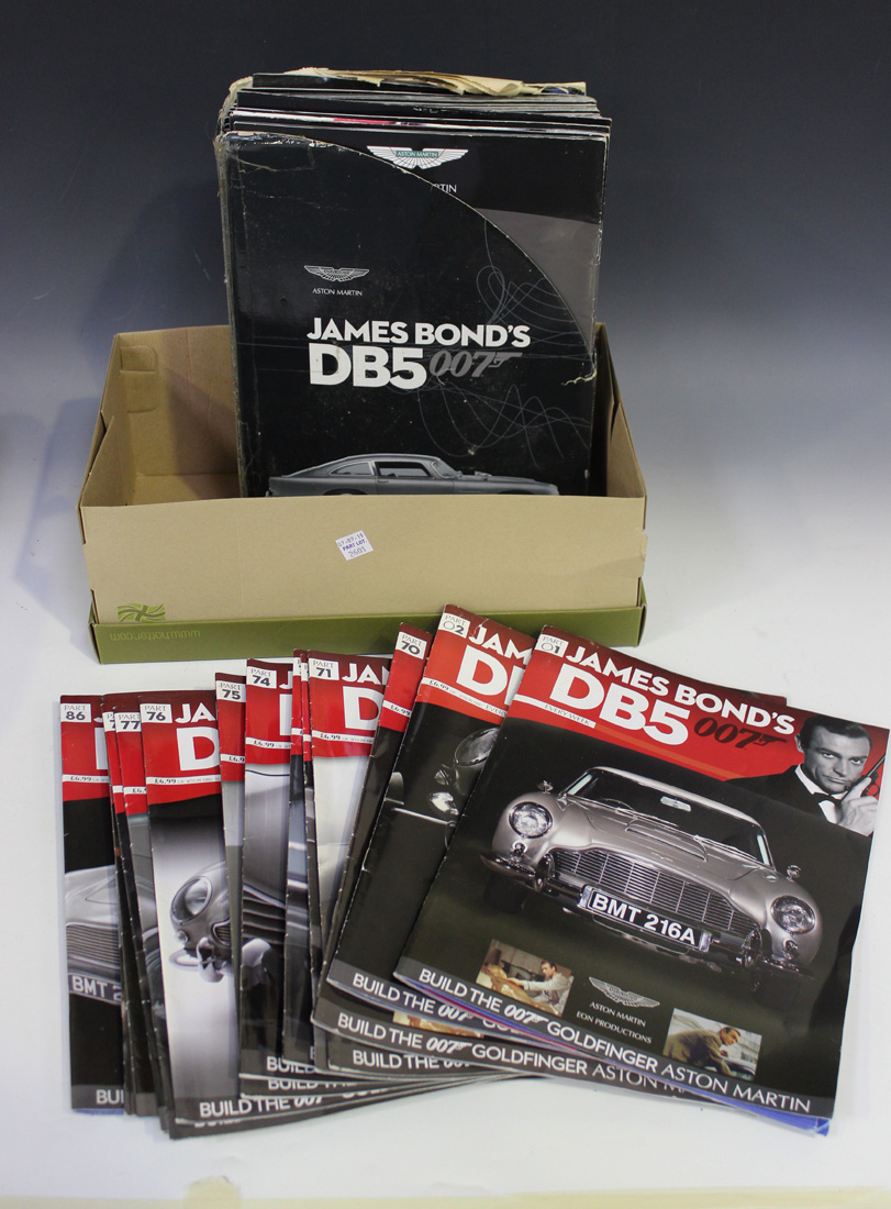A 1:8 scale replica model of James Bond's Aston Martin DB5, together with related magazine issues. - Image 2 of 5