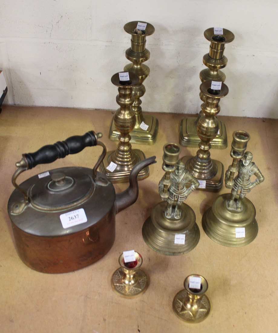A small collection of copper and brassware, including a warming pan, a kettle, candlesticks and