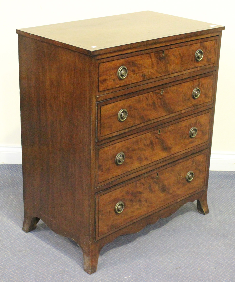 A 20th Century George III style mahogany chest of four graduated long drawers, on splayed bracket