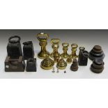 A collection of late 19th and early 20th Century brass and cast iron kitchen weights.