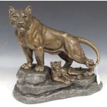 After Louis-Albert Carvin - an early 20th Century patinated cast spelter figure of a lioness