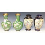 A pair of Chinese cloisonné vases, 20th Century, each narrow neck and shouldered body decorated with