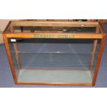 A Hornby-Dublo oak glazed shop display cabinet, fitted with a shelf, height approx 60.5cm, width