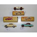 Three Dinky Toys cars, comprising a No. 109 Austin Healey '100' sports, a No. 157 Jaguar XK120 and a