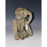 An early 20th Century Steiff mohair mechanical elephant with boot button eyes and stitched toes,