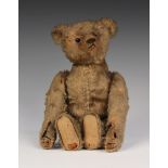 An early Steiff mohair clockwork teddy bear with button in left ear, boot button eyes, stitched