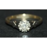 A gold, platinum and diamond set single stone ring, mounted with a circular cut diamond, detailed '