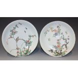 Two Chinese famille verte porcelain saucer dishes, Kangxi period, the first painted with a bird