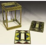 A mid-19th Century pressed brass and leaded stained glass hanging lantern with arched supports,