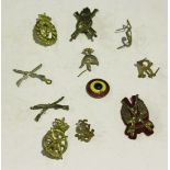 A quantity of military badges etc, including an R.H.A. white metal grenade plume holder, a Mine