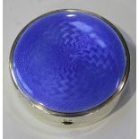 A George V silver circular powder compact, the engine turned hinge lid enamelled in blue, Birmingham