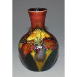 A Moorcroft flambé pottery posy vase, circa 1953-1978, decorated with Orchid design, applied printed