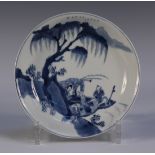 A Chinese blue and white porcelain saucer dish, Kangxi period, attractively painted with a narrative
