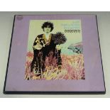 A small collection of folk records, including 'A Gift from a Flower to a Garden' by Donovan and
