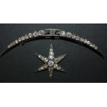 A late Victorian diamond set brooch, designed as a six pointed starburst and a shallow crescent,
