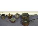 A collection of copper ware, including a hanging lantern, a watering can and two pans.