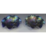 Two Northwood blue carnival glass ruffled rim bowls, early 20th Century, each moulded in relief with