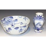 A Dutch Delft blue and white bowl, mid-18th Century, of steep sided circular form, painted to inside