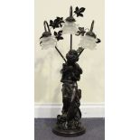 A late 19th Century patinated cast spelter figural table lamp in the form of a winged maiden,