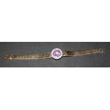 A 9ct gold, diamond and amethyst bracelet, the front collet set with the circular cut amethyst in